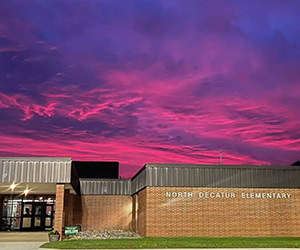Beautiful pink sky over North Decatur Elementary school building